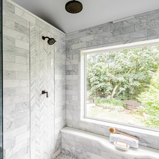 Bathroom - large master gray tile and marble tile marble floor, white floor, double-sink, vaulted ceiling and wood wall bathroom idea in Philadelphia with medium tone wood cabinets, a bidet, gray walls, an undermount sink, quartzite countertops, a hinged shower door, white countertops and a built-in vanity