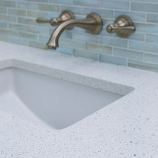 Design ideas for a mid-sized modern master bathroom in Boston with a wall-mount sink and recycled glass benchtops.