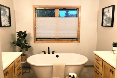 Bathroom - transitional master ceramic tile ceramic tile and single-sink bathroom idea in Minneapolis with shaker cabinets, medium tone wood cabinets, an undermount sink, quartz countertops, a hinged shower door, white countertops and a freestanding vanity