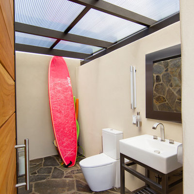Mid-sized trendy multicolored tile and stone tile slate floor bathroom photo in San Luis Obispo with a console sink, beige walls, open cabinets and a two-piece toilet