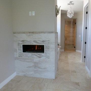 Electric fireplace in down master bathroom