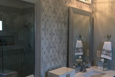 Design ideas for a medium sized classic ensuite bathroom in Nashville with flat-panel cabinets, grey cabinets, a built-in bath, a corner shower, beige tiles, porcelain tiles, grey walls, a submerged sink, marble worktops and a hinged door.