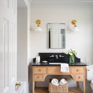 Alcove bathtub - mid-sized french country master mosaic tile floor, single-sink, shiplap wall and gray floor alcove bathtub idea in DC Metro with a two-piece toilet, beige walls, an undermount sink, soapstone countertops, black countertops, a freestanding vanity, flat-panel cabinets and light wood cabinets