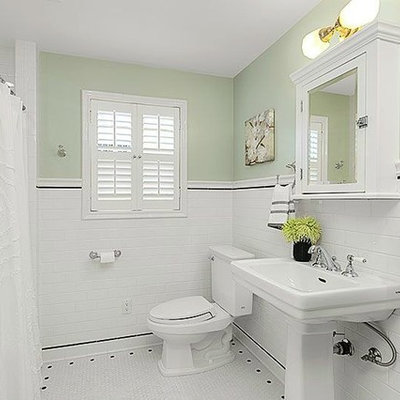 Small arts and crafts white tile and mosaic tile mosaic tile floor bathroom photo in Seattle with a two-piece toilet, green walls and a pedestal sink