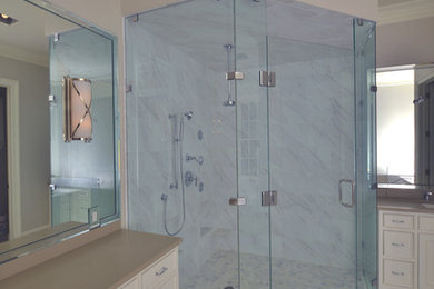 Corner shower - large contemporary master white tile and marble tile marble floor and white floor corner shower idea in Minneapolis with a hinged shower door, beaded inset cabinets, white cabinets, gray walls, an undermount sink and quartz countertops