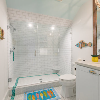 Inspiration for a tropical 3/4 white tile and subway tile mosaic tile floor and white floor bathroom remodel in Miami with shaker cabinets, white cabinets, a two-piece toilet, white walls and an undermount sink