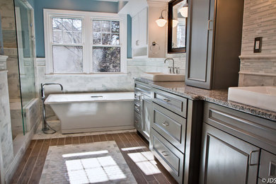 Design ideas for a medium sized classic ensuite bathroom in DC Metro with a built-in sink, raised-panel cabinets, grey cabinets, granite worktops, a freestanding bath, a walk-in shower, a two-piece toilet, white tiles, stone tiles, blue walls and ceramic flooring.