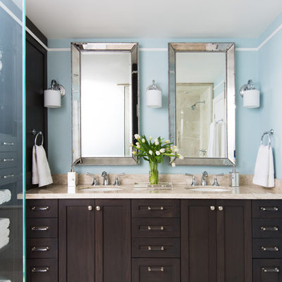 Mid-sized elegant beige tile travertine floor corner shower photo in Toronto with an undermount sink, shaker cabinets, dark wood cabinets and blue walls