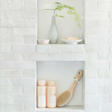 emily henderson's classic modern master bathroom with weathered white subway