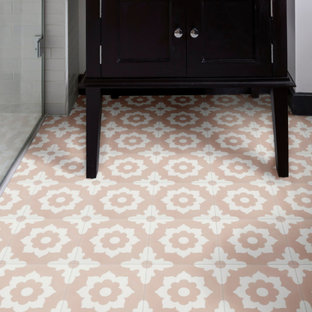 Design ideas for an arts and crafts bathroom in London with white tile, porcelain floors and pink floor.