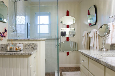 Example of a transitional white tile ceramic tile bathroom design in Austin with an undermount sink, recessed-panel cabinets, white cabinets, granite countertops, a one-piece toilet and beige walls