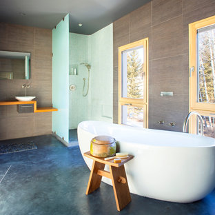 Trendy concrete floor bathroom photo in Other with a vessel sink