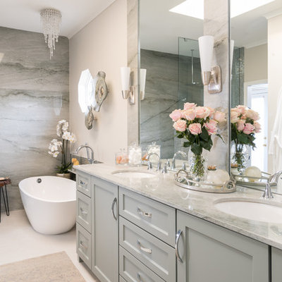 Bathroom - mid-sized transitional master green tile and mosaic tile porcelain tile and beige floor bathroom idea in Dallas with shaker cabinets, green cabinets, a bidet, beige walls, an undermount sink, quartzite countertops and green countertops
