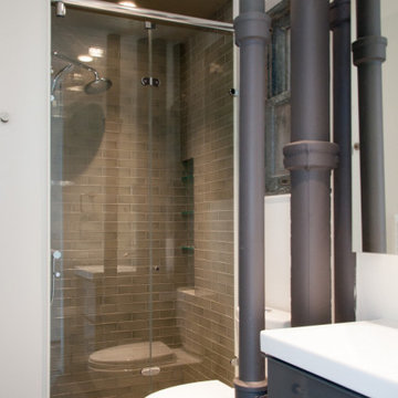 Exposed pipe and shower niche in Guest Bathroom