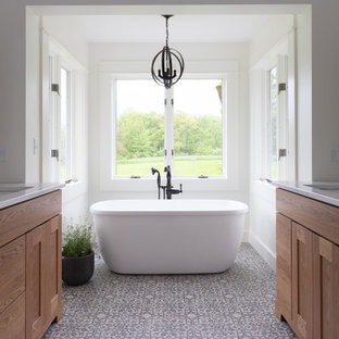 Bathroom - mid-sized cottage master mosaic tile floor and multicolored floor bathroom idea in Other with flat-panel cabinets, light wood cabinets, white walls, a drop-in sink, quartzite countertops, a hinged shower door and white countertops