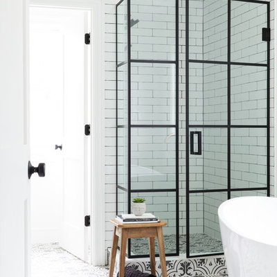Example of a mid-sized farmhouse master white tile and ceramic tile porcelain tile and white floor bathroom design in New York with white walls and a hinged shower door