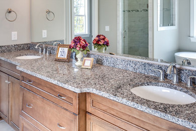 Example of a trendy master bathroom design in Other with granite countertops