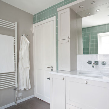 Family bathroom featuring bespoke vanity with carrara marble countertop