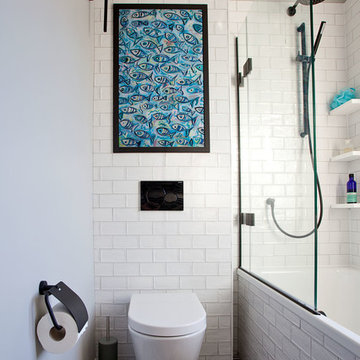 Family bathroom with matt black detailing and patterned tile floor – Hove