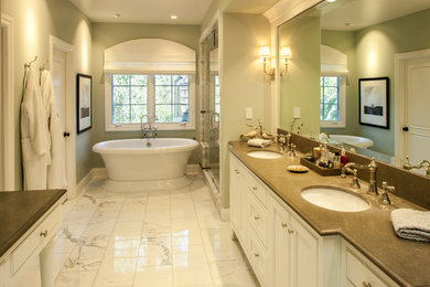 Bathroom - master stone tile and multicolored tile marble floor bathroom idea in San Francisco with an undermount sink, beaded inset cabinets, white cabinets, a one-piece toilet, green walls and granite countertops
