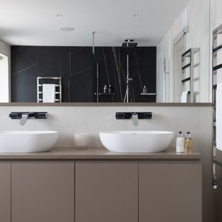 Design ideas for a large contemporary ensuite bathroom in Hertfordshire with beige cabinets, a one-piece toilet, porcelain tiles, porcelain flooring, quartz worktops, beige worktops, flat-panel cabinets, a vessel sink, grey floors and double sinks.