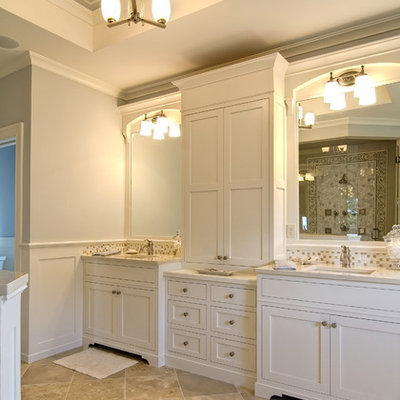 Elegant beige tile and mosaic tile bathroom photo in Other with shaker cabinets and white cabinets