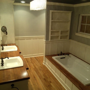 Example of a large farmhouse bathroom design in Dallas