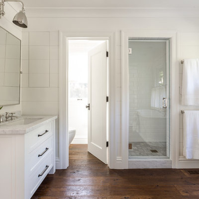 Alcove shower - mid-sized farmhouse master white tile and subway tile dark wood floor alcove shower idea in San Francisco with an undermount sink, shaker cabinets, white cabinets and white walls