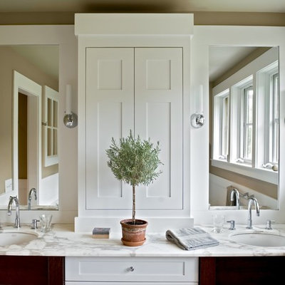 Country bathroom photo in Burlington with marble countertops