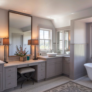 Inspiration for a cottage master multicolored floor freestanding bathtub remodel in San Francisco with shaker cabinets, gray cabinets, gray walls and a vessel sink