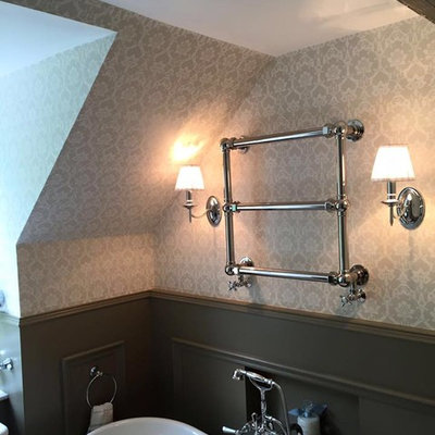 Example of a mid-sized cottage chic freestanding bathtub design in Glasgow with a wall-mount toilet