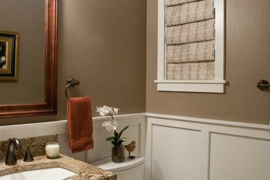 Bathroom - small traditional 3/4 ceramic tile bathroom idea in Seattle with an undermount sink, dark wood cabinets, granite countertops, a two-piece toilet, brown walls, furniture-like cabinets and brown countertops