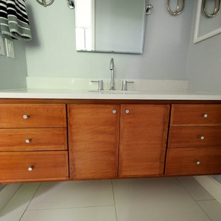 Inspiration for a mid-sized contemporary master white tile and porcelain tile porcelain tile bathroom remodel in Denver with an undermount sink, flat-panel cabinets, medium tone wood cabinets, quartz countertops and blue walls