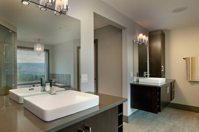 Example of a minimalist master bathroom design in Vancouver with a vessel sink, flat-panel cabinets, dark wood cabinets and gray walls