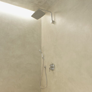 Trendy concrete floor bathroom photo in Miami with gray walls, an integrated sink and concrete countertops