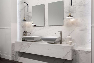 Photo of a contemporary bathroom in New York with white tiles and porcelain tiles.