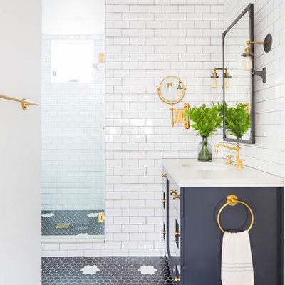 Mid-sized beach style 3/4 white tile and subway tile black floor alcove shower photo in Orange County with shaker cabinets, blue cabinets, an undermount sink, white countertops and a hinged shower door
