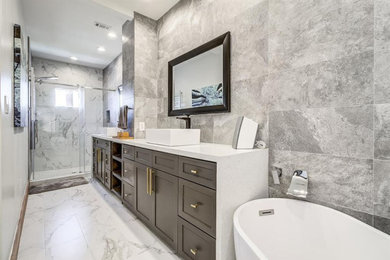 Tuscan master gray tile and porcelain tile porcelain tile, white floor and double-sink bathroom photo in Houston with shaker cabinets, gray cabinets, a one-piece toilet, gray walls, a vessel sink, quartz countertops, white countertops and a built-in vanity