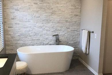Bathroom - large contemporary master white tile and stone tile vinyl floor and gray floor bathroom idea in Boise with shaker cabinets, white cabinets, a two-piece toilet, gray walls, a drop-in sink, quartzite countertops and gray countertops