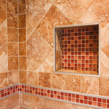 Framed shower niche with mosaic tiles
