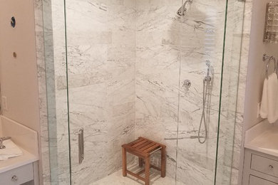 Corner shower - contemporary corner shower idea in Miami with a hinged shower door