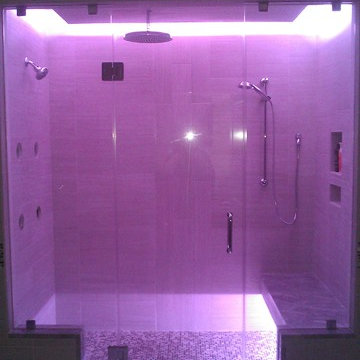 Frameless Glass Shower with Bench Seat and Custom Lighting