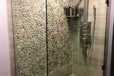 Corner shower - transitional beige tile, gray tile, white tile and pebble tile corner shower idea in Philadelphia