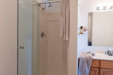 Minimalist corner shower photo in Vancouver with a hinged shower door