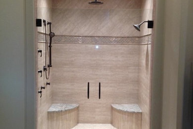 Inspiration for a mid-sized transitional master beige tile alcove shower remodel in Other with a hinged shower door