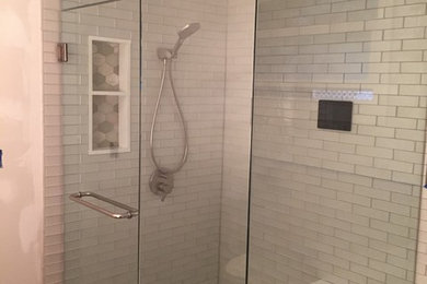 Alcove shower - mid-sized contemporary master white tile and porcelain tile alcove shower idea in San Francisco with white walls