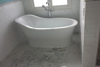 Photo of a medium sized traditional ensuite bathroom in Nashville with a walk-in shower, white tiles, stone tiles, blue walls, marble flooring and multi-coloured floors.