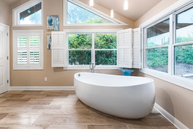 Example of a large trendy master beige tile and porcelain tile porcelain tile and beige floor bathroom design in San Francisco with shaker cabinets, dark wood cabinets, a one-piece toilet, beige walls, an undermount sink and granite countertops