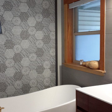 Freestanding tub with hexagon accent tile feature wall