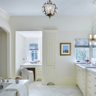 Example of a mid-sized french country master white tile and marble tile marble floor, white floor and double-sink drop-in bathtub design in Minneapolis with recessed-panel cabinets, white cabinets, white walls, an integrated sink, marble countertops, white countertops and a built-in vanity